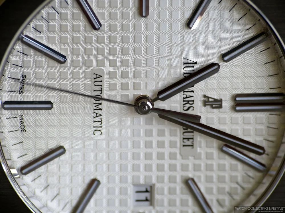 Audemars Piguet white tapisserie dial macro showing petite tapisserie pattern